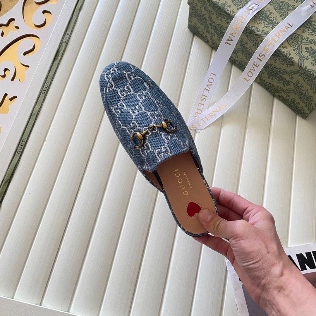 Gucci Princetown mules in light blue and ivory GG denim with gold-tone horsebit hardware