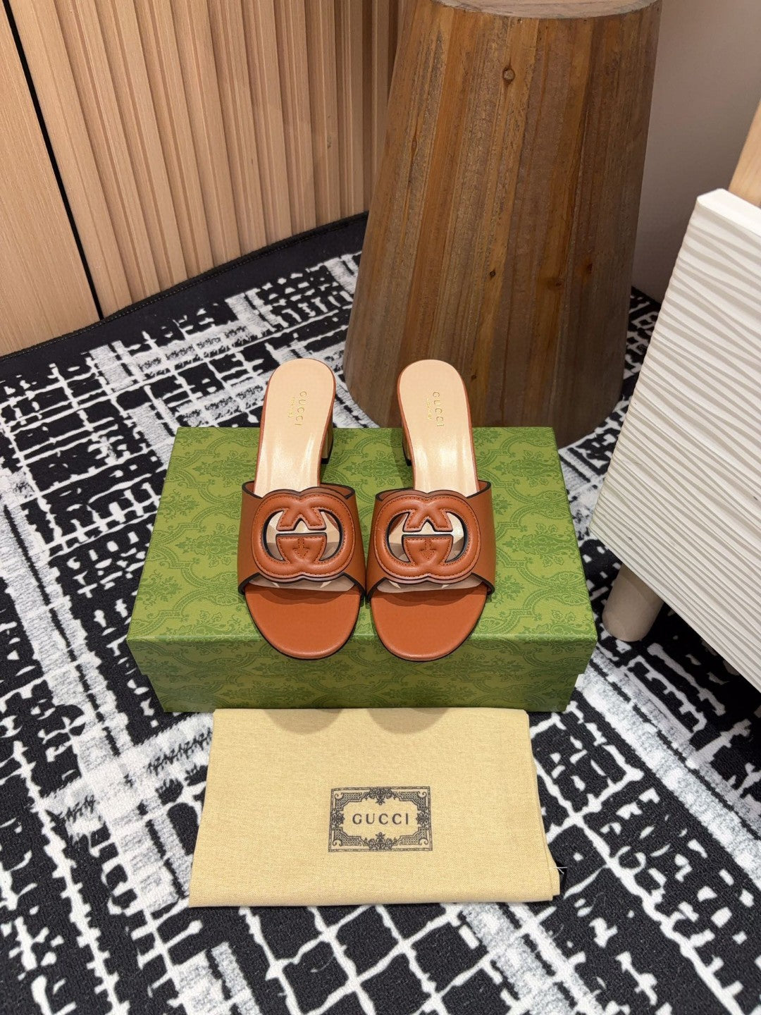 brown leather Gucci Interlocking G Slide Mules with a 55mm heel