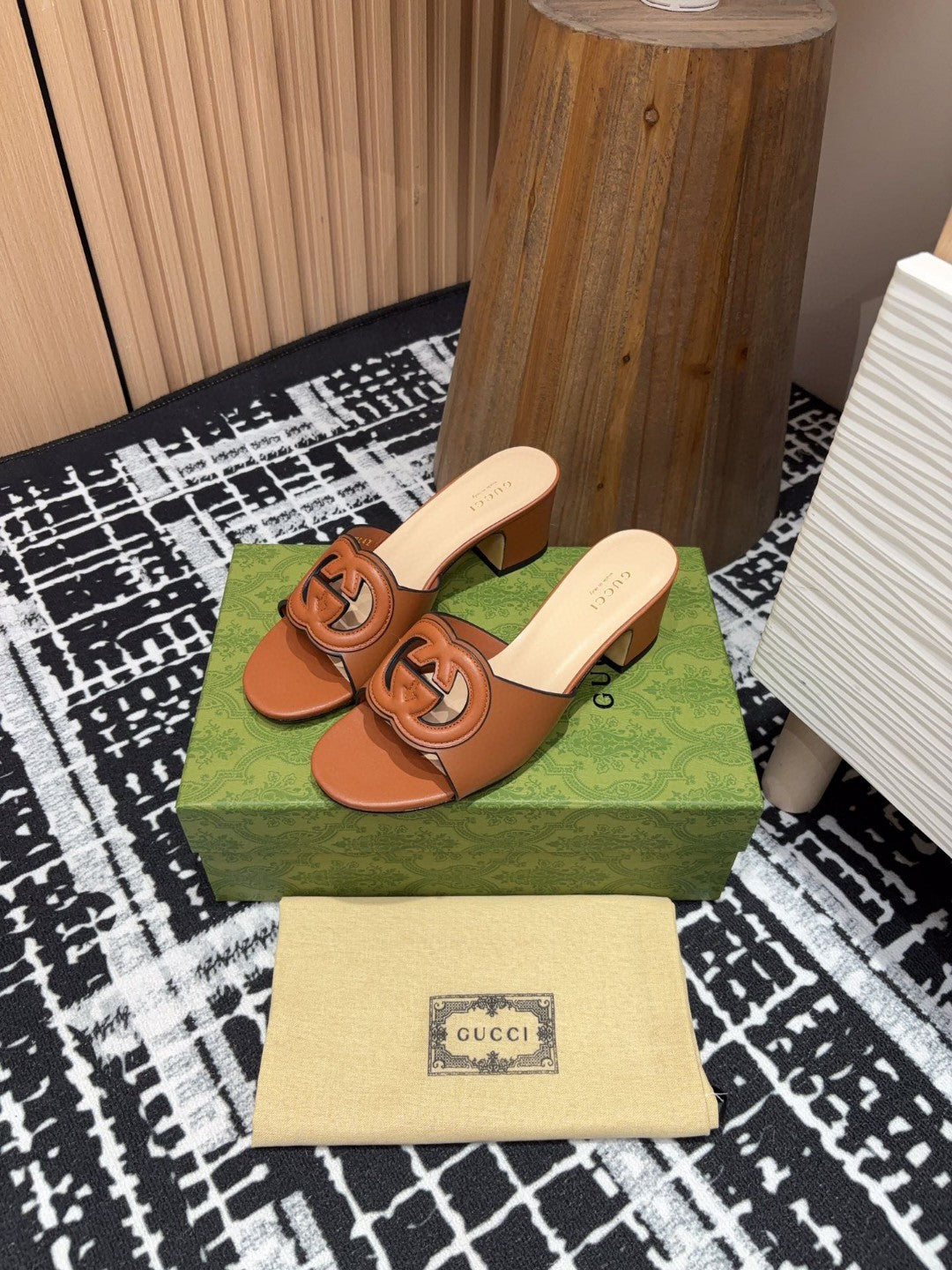 brown leather Gucci Interlocking G Slide Mules with a 55mm heel