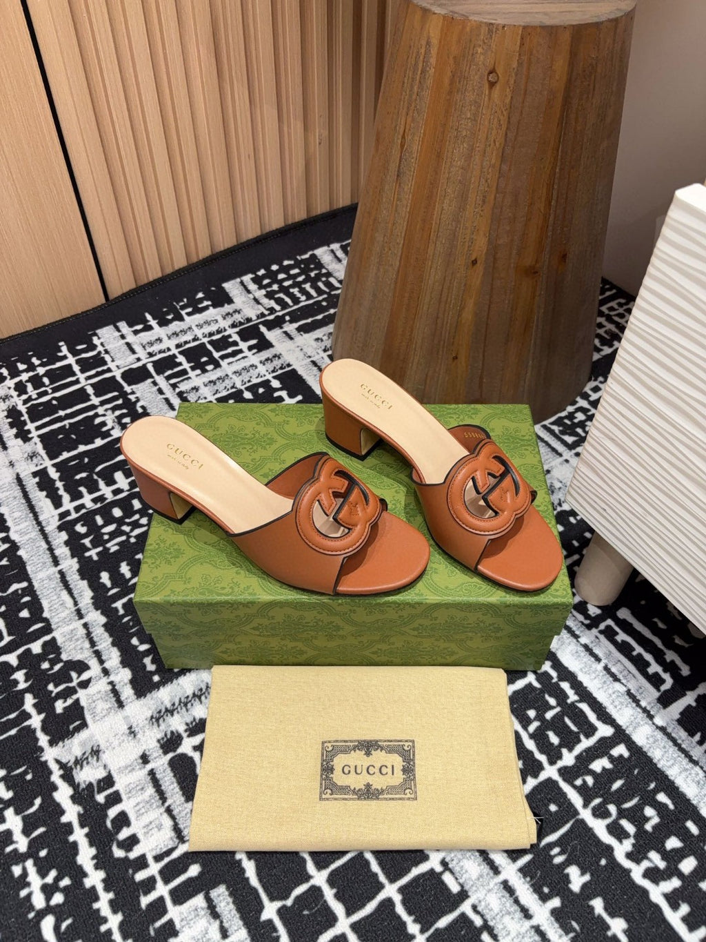 brown leather Gucci Interlocking G Slide Mules with a 55mm heel