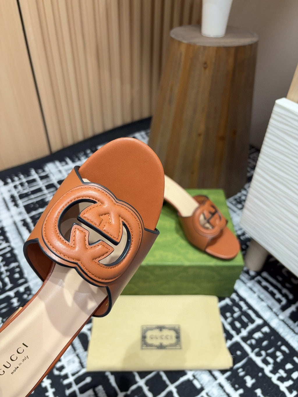 brown leather Gucci Interlocking G Slide Mules with a 55mm heel