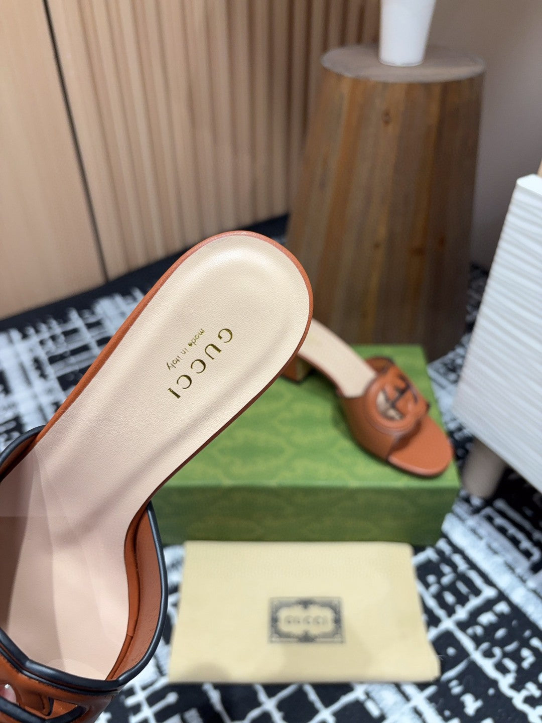 brown leather Gucci Interlocking G Slide Mules with a 55mm heel