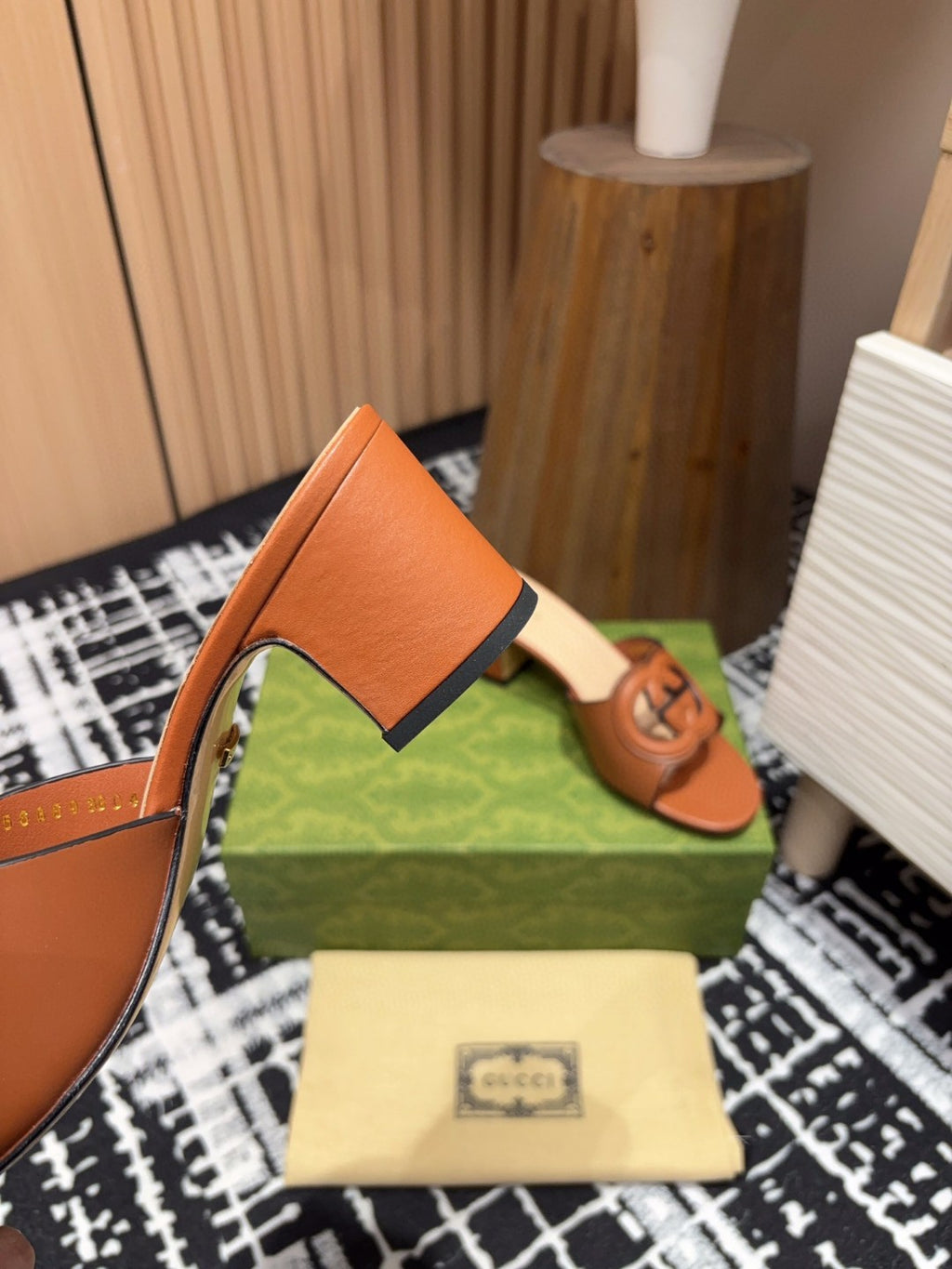 brown leather Gucci Interlocking G Slide Mules with a 55mm heel