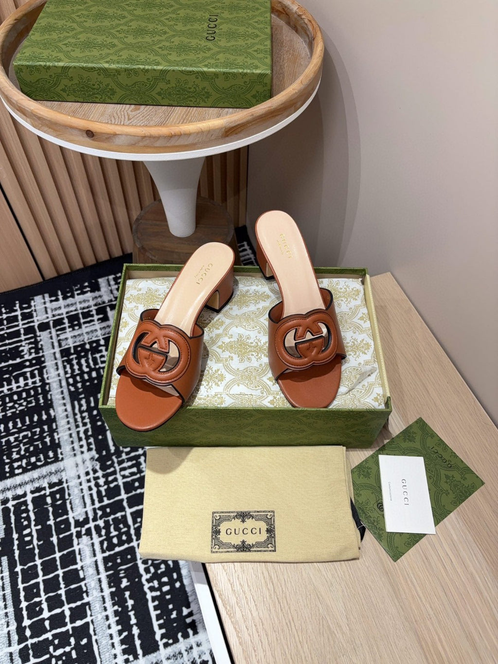 brown leather Gucci Interlocking G Slide Mules with a 55mm heel