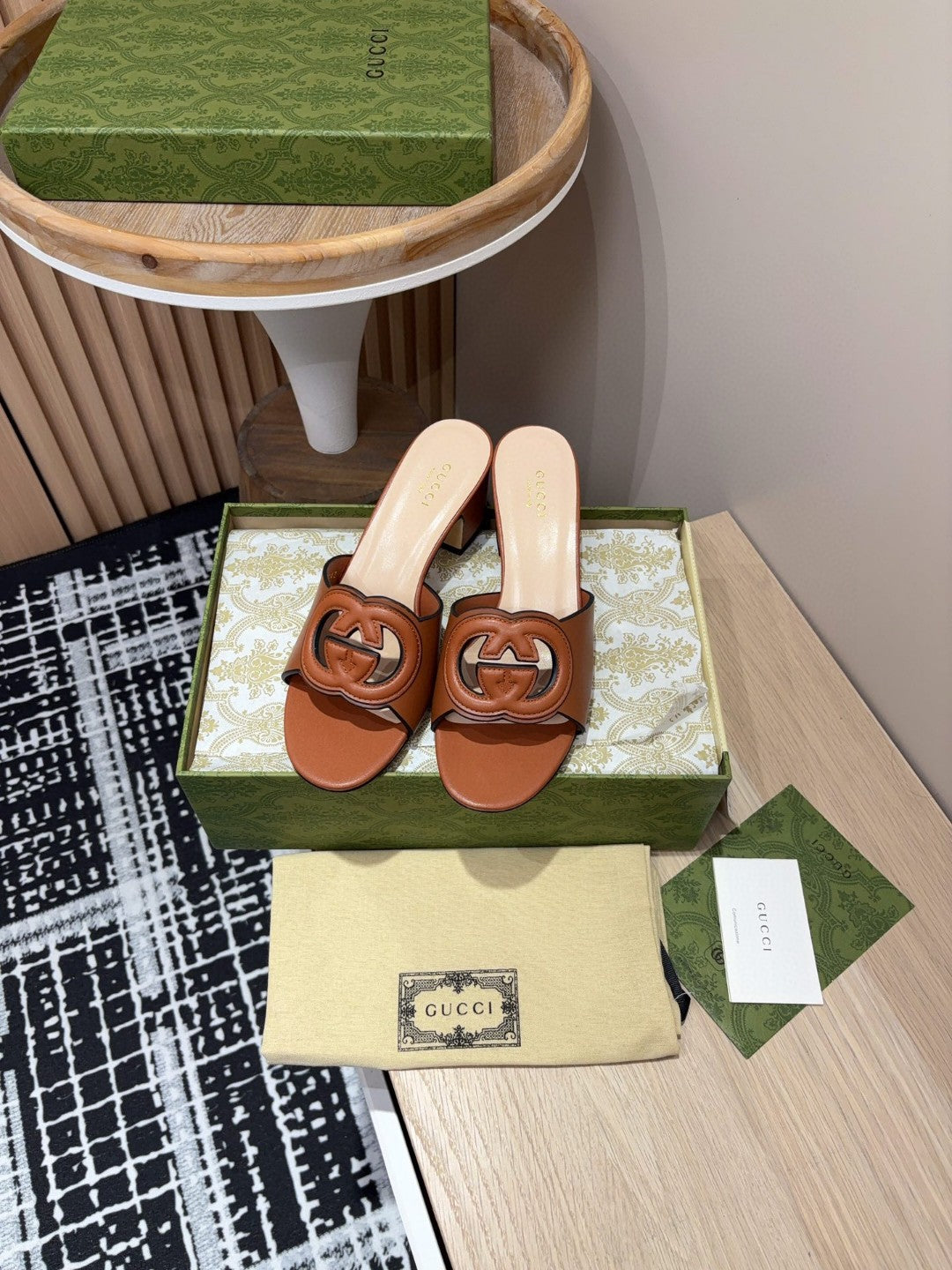 brown leather Gucci Interlocking G Slide Mules with a 55mm heel