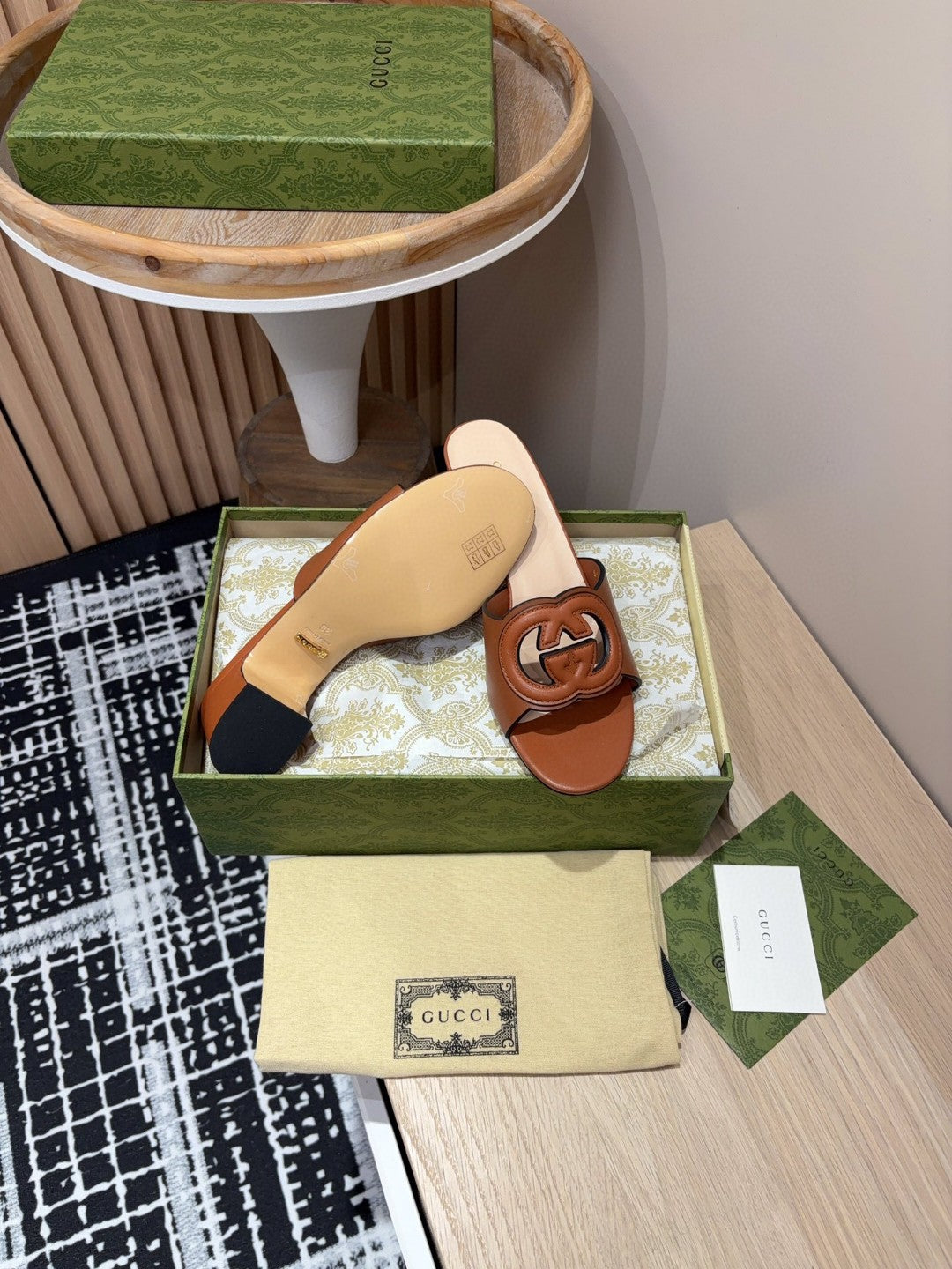 brown leather Gucci Interlocking G Slide Mules with a 55mm heel