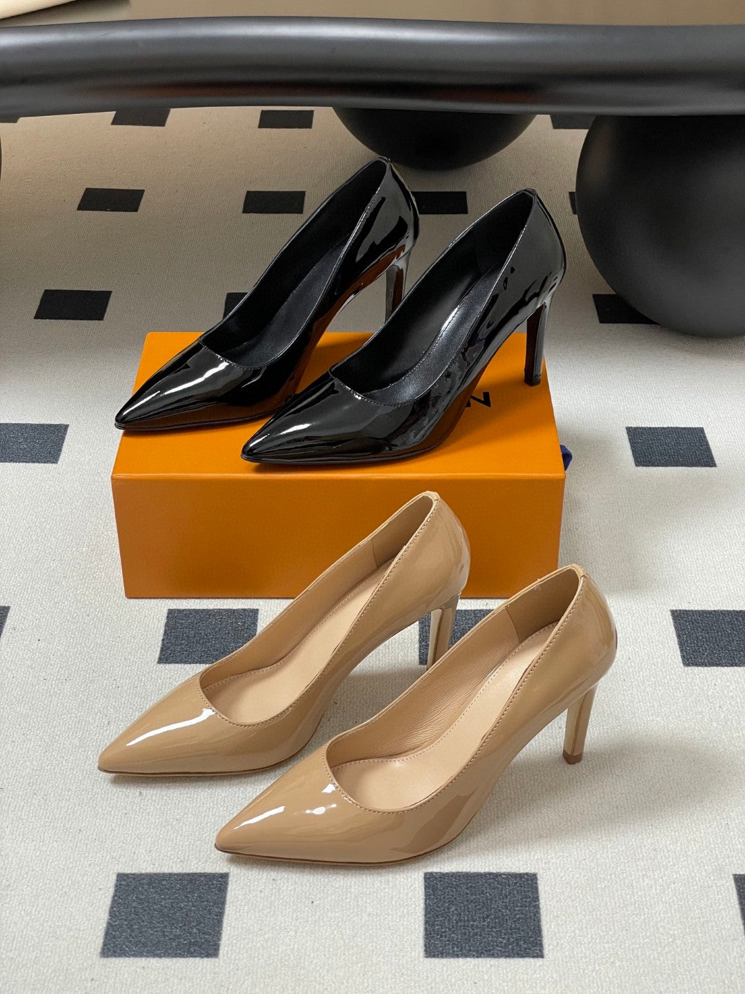 LV women's pointed-toe stiletto high-heel pumps in black and nude patent leather