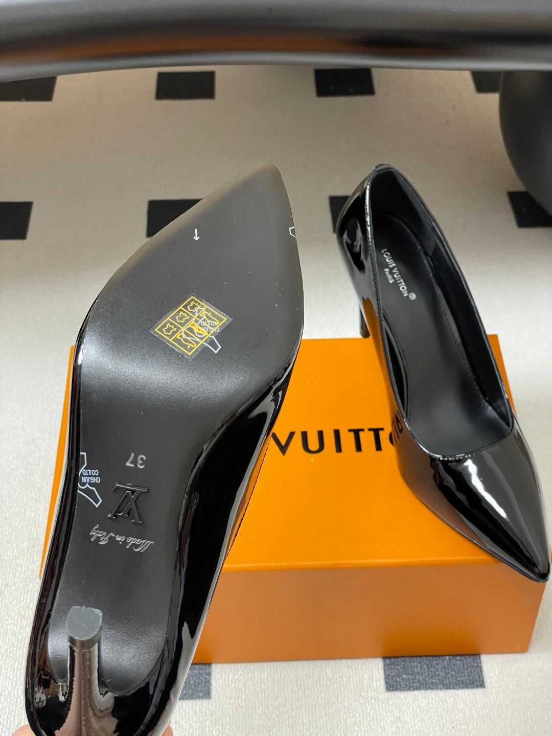 LV women's pointed-toe stiletto high-heel pumps in black and nude patent leather
