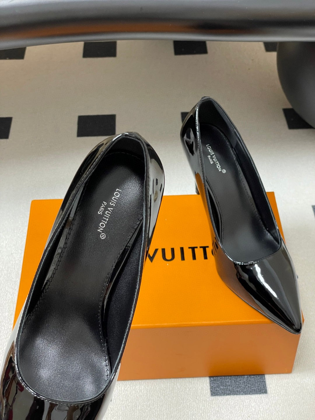 LV women's pointed-toe stiletto high-heel pumps in black and nude patent leather