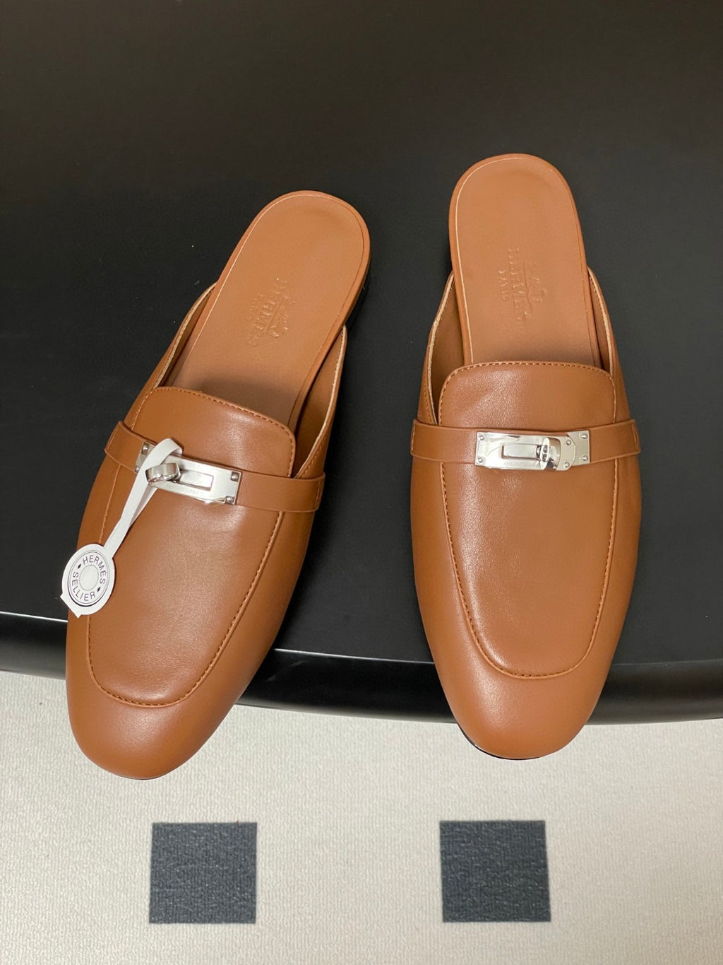 Hermès Oz mules in brown calfskin leather with a palladium-plated Kelly buckle