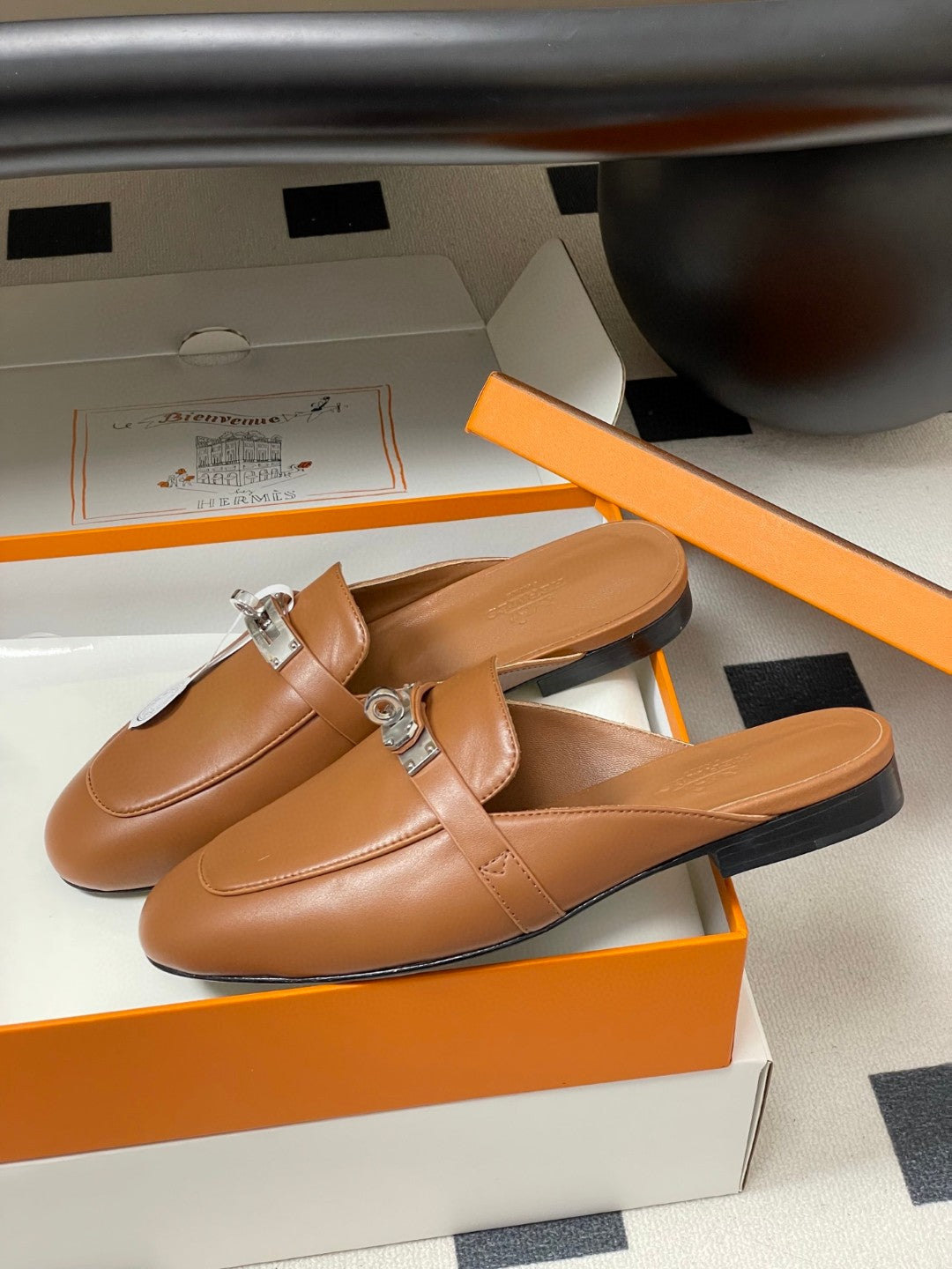 Hermès Oz mules in brown calfskin leather with a palladium-plated Kelly buckle
