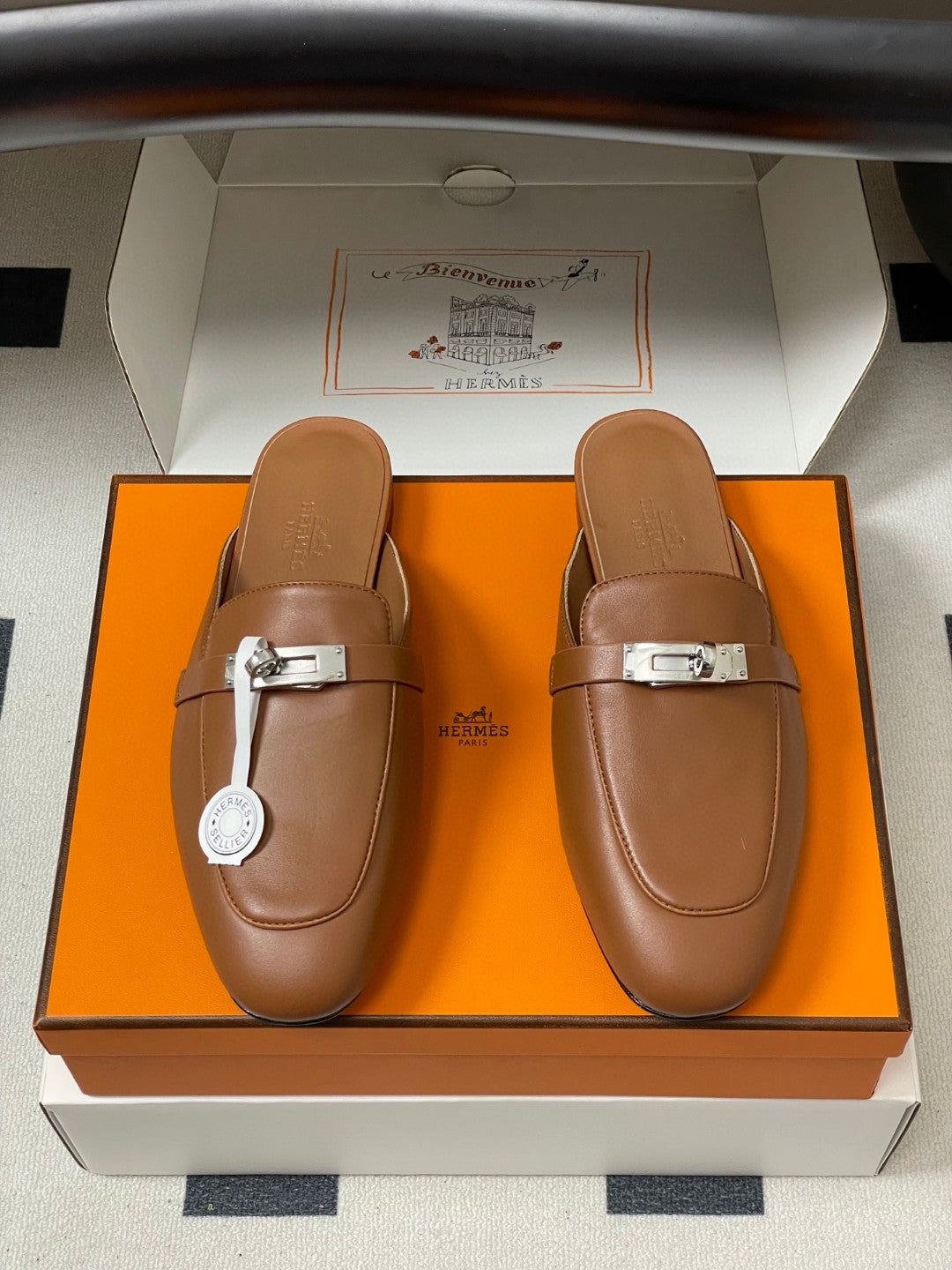 Hermès Oz mules in brown calfskin leather with a palladium-plated Kelly buckle