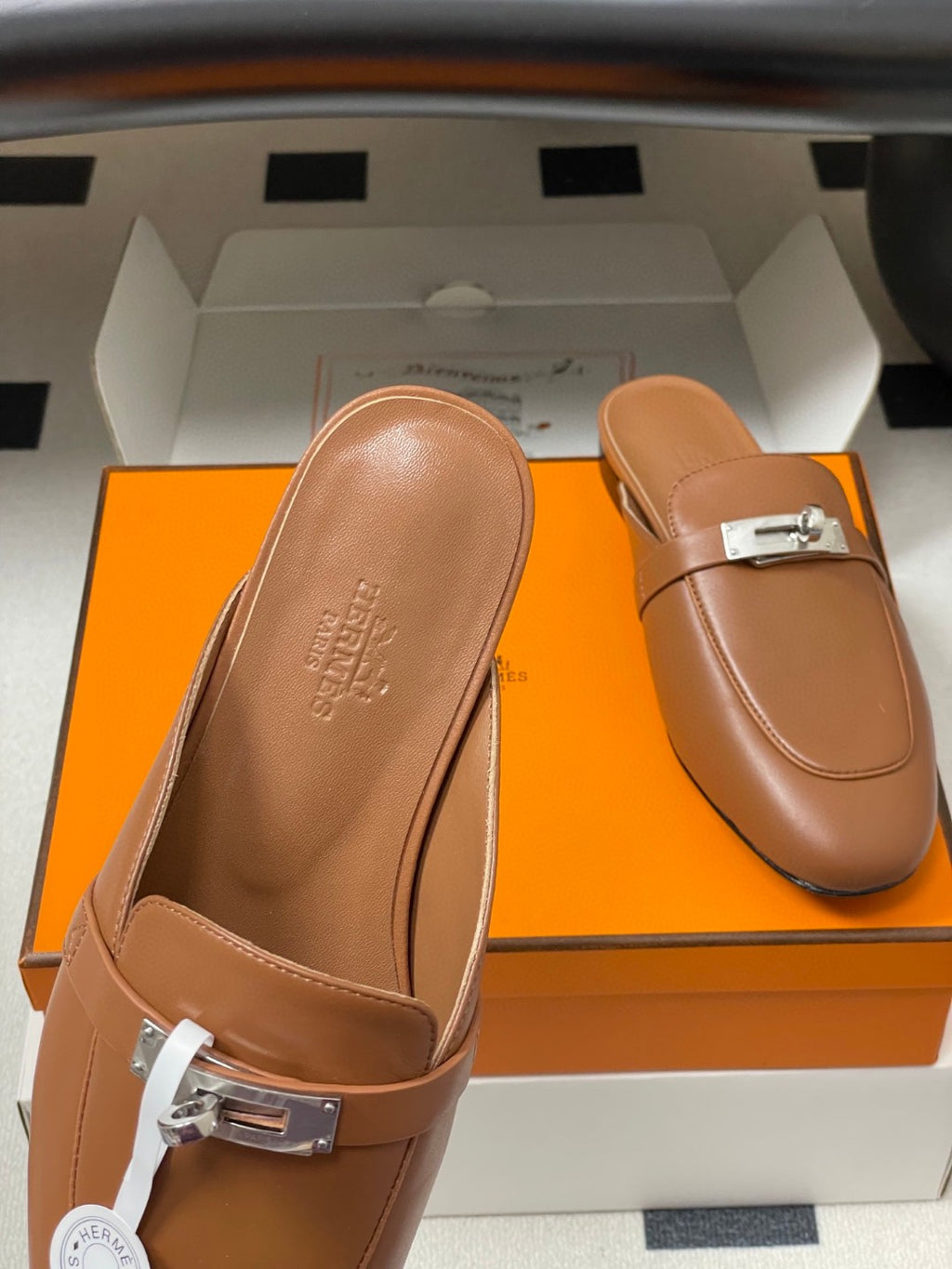 Hermès Oz mules in brown calfskin leather with a palladium-plated Kelly buckle
