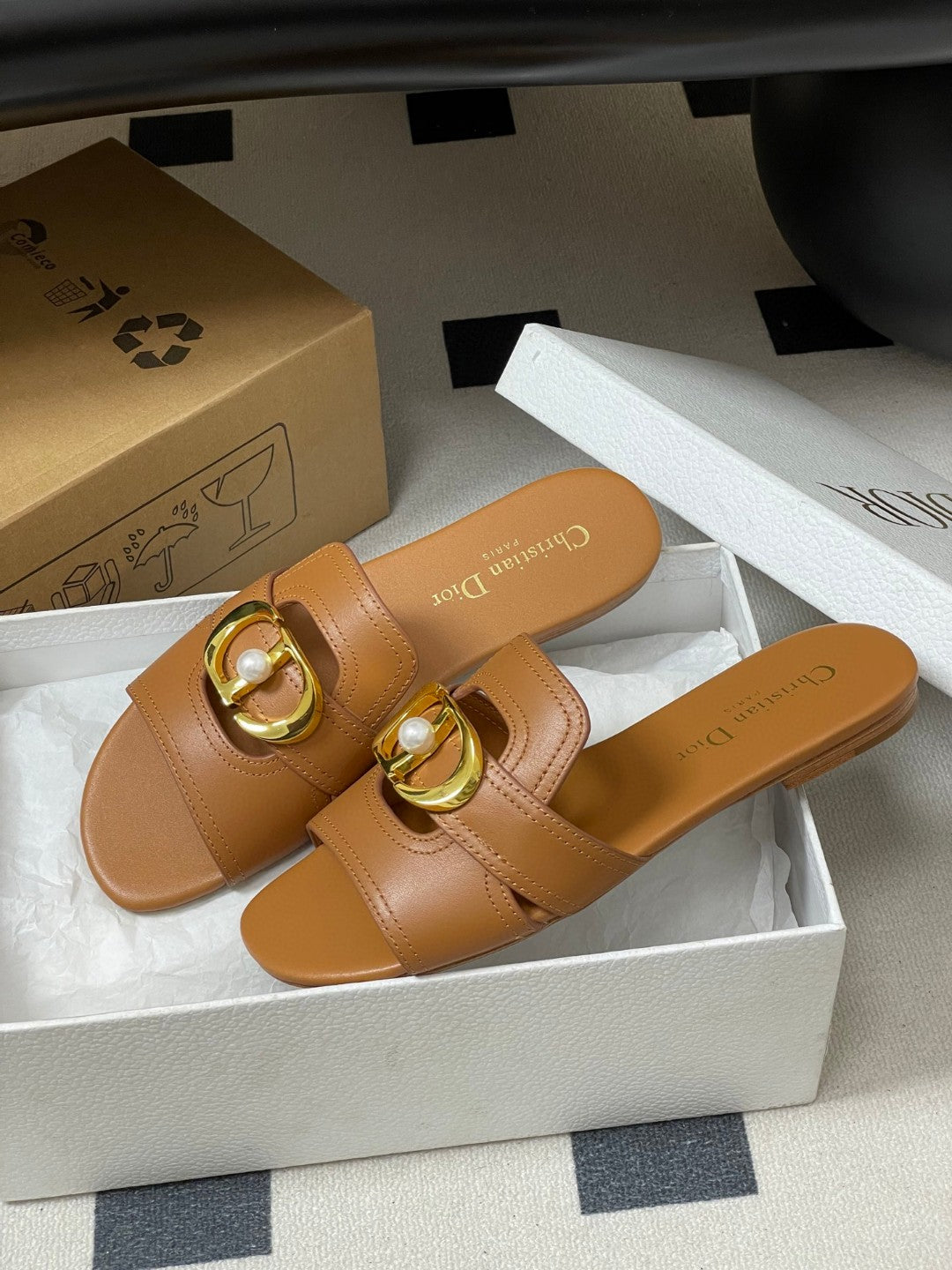 Dior 30 Montaigne flat slide sandals in beige calfskin leather with a gold-finish metal "CD" signature