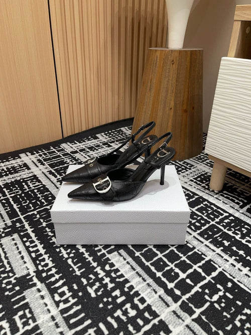 black Dior pumps with a buckle detail