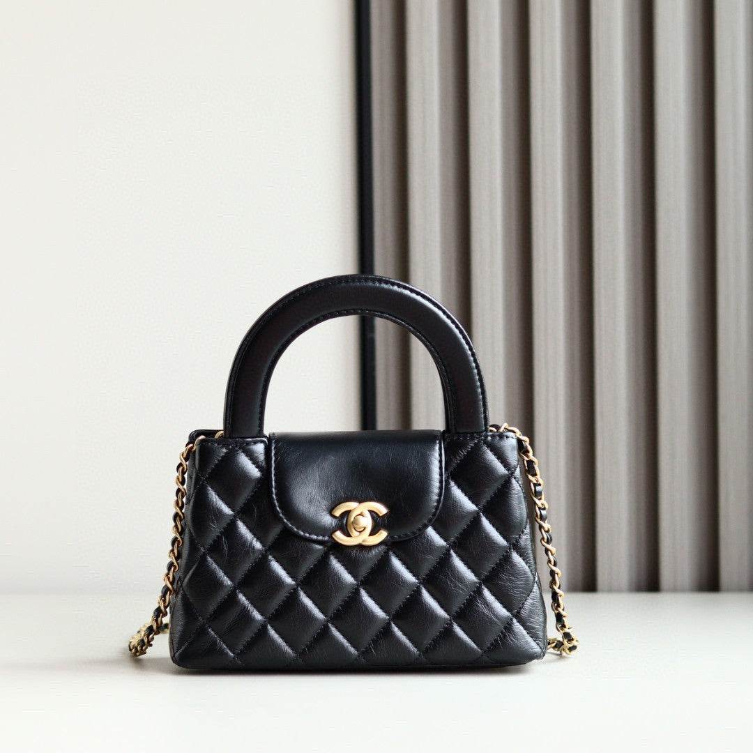 Chanel Mini Kelly bag in black calfskin with gold-tone metal hardware