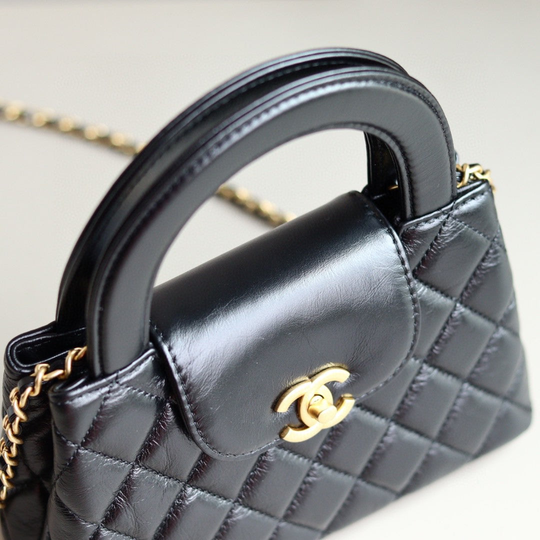 Chanel Mini Kelly bag in black calfskin with gold-tone metal hardware