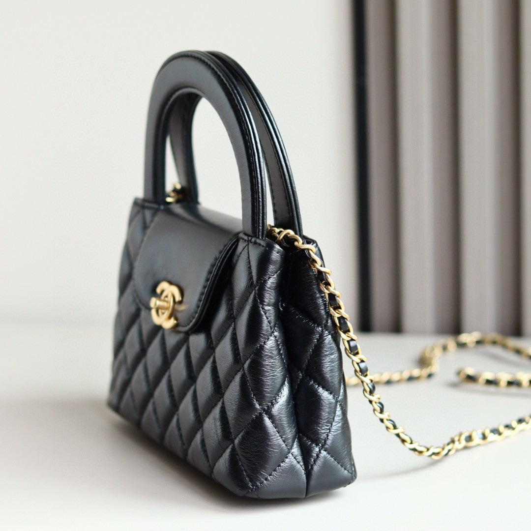Chanel Mini Kelly bag in black calfskin with gold-tone metal hardware