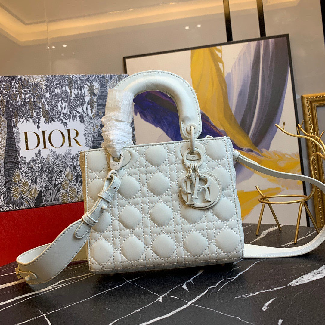 black Dior Lady Dior bag in cannage lambskin leather.