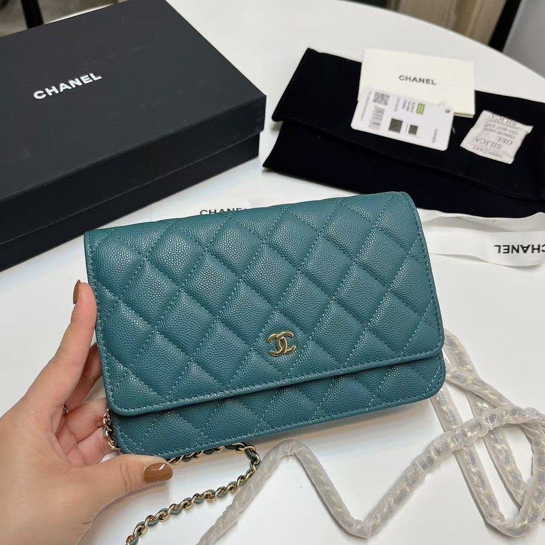 Chanel Wallet on Chain (WOC) bag in red caviar leather with gold-tone hardware