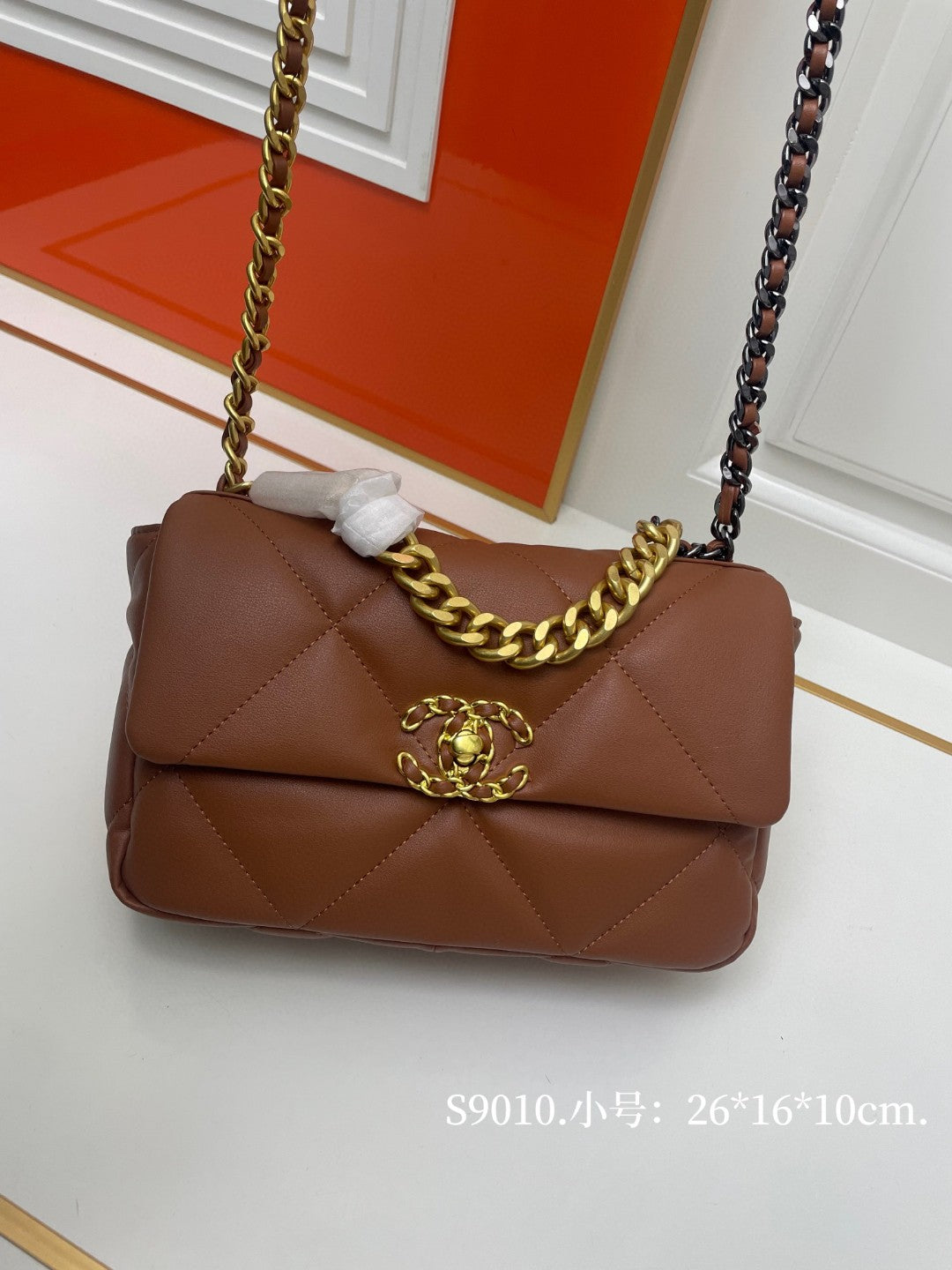 black Chanel 19 flap bag in lambskin with gold-tone