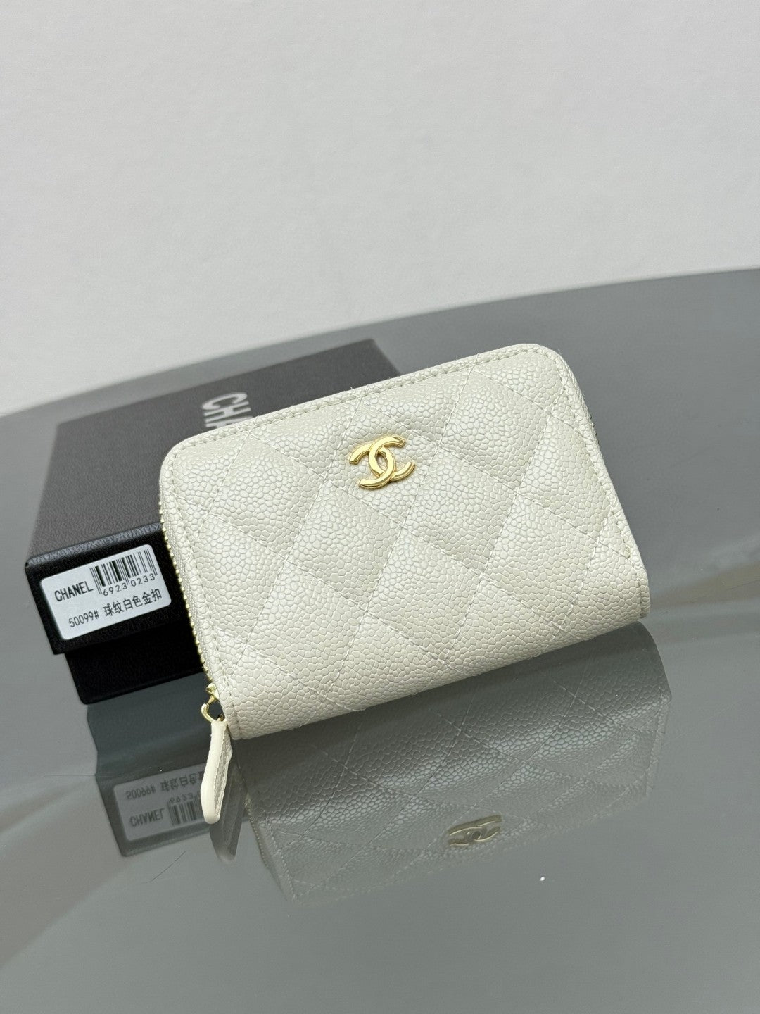 Chanel Classic Zipped Coin Purse in black quilted caviar leather with gold-tone hardware