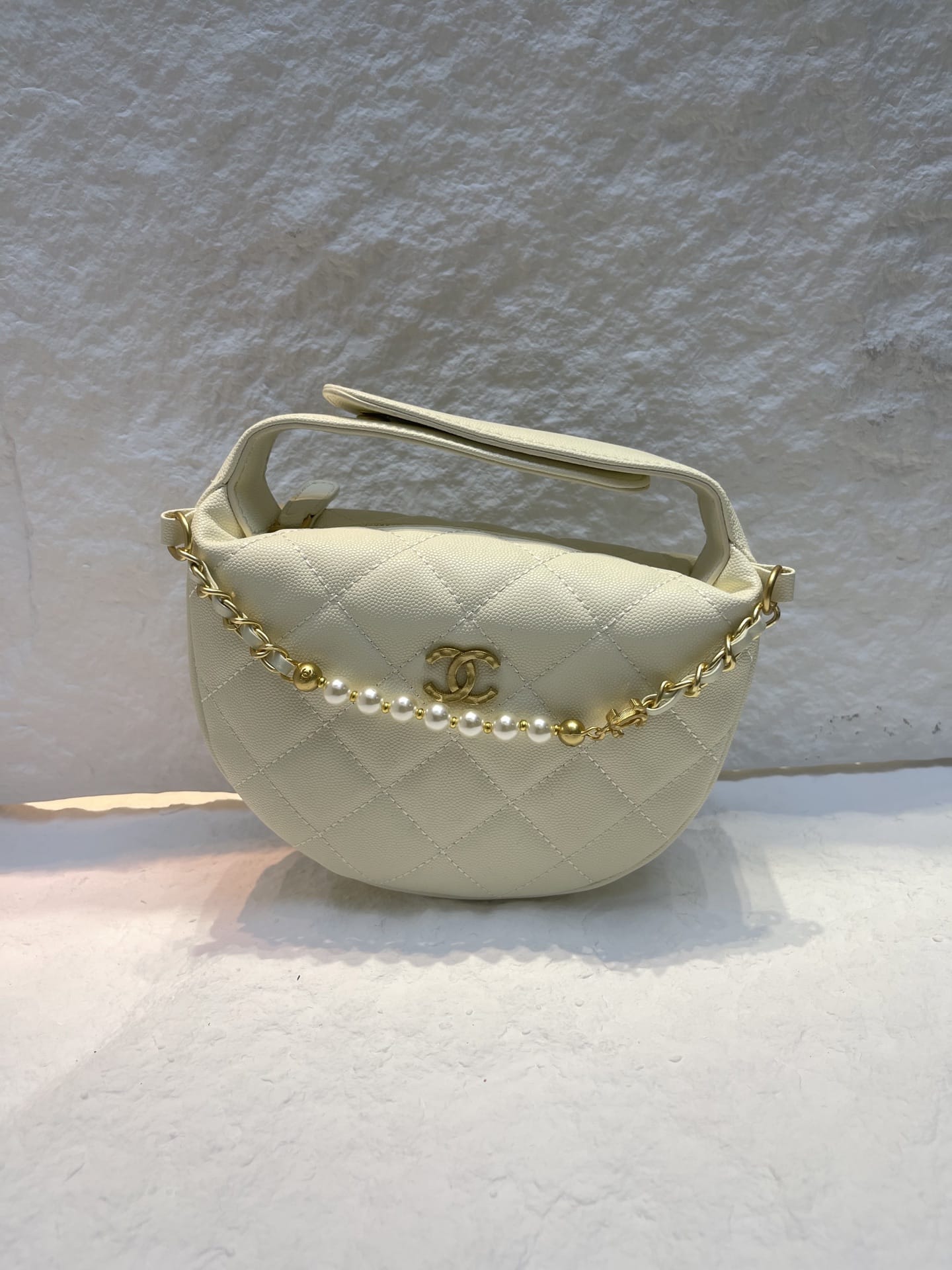 Chanel Spring-Summer 2025 (25S) pouch in black grained calfskin leather with imitation pearl and gold-tone metal hardware