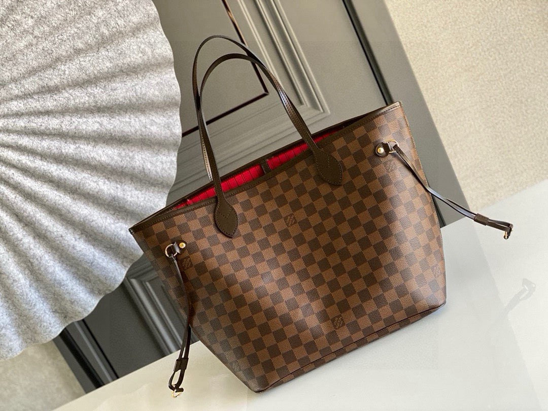Louis Vuitton Neverfull MM tote bag in the Damier Ebene canvas with a red interior lining