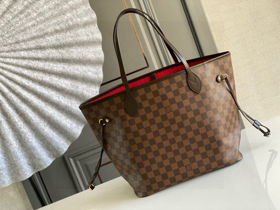 Louis Vuitton Neverfull MM tote bag in the Damier Ebene canvas with a red interior lining