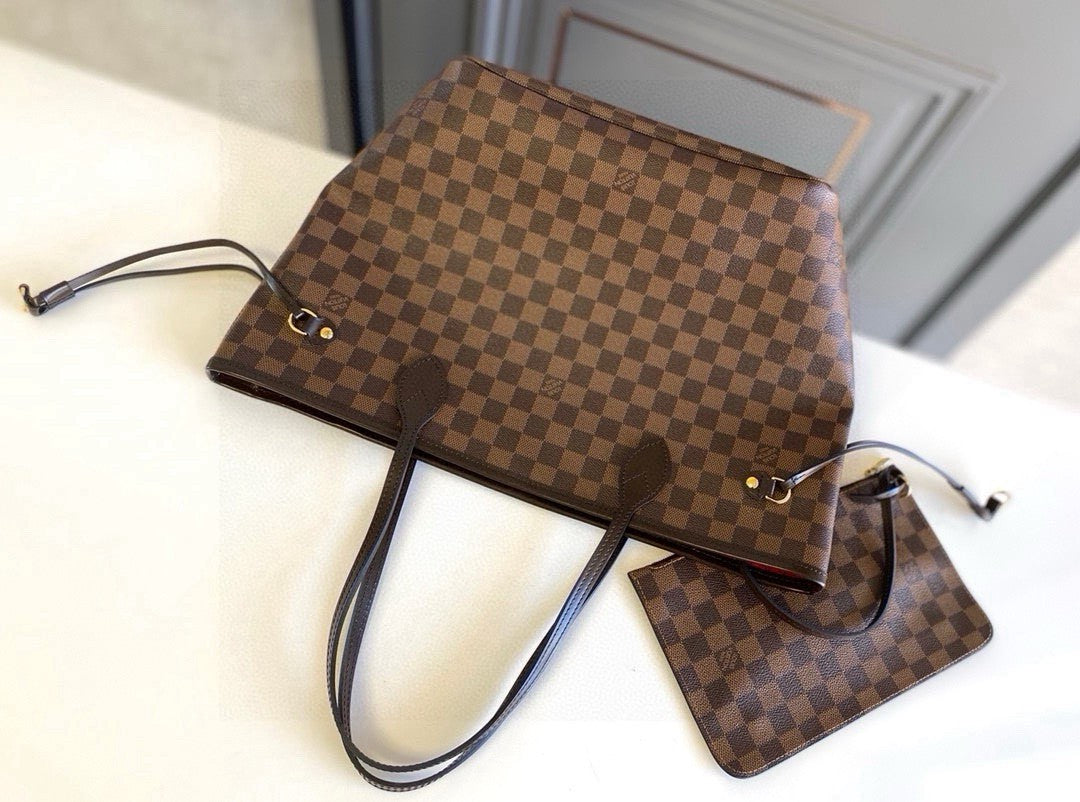 Louis Vuitton Neverfull MM tote bag in the Damier Ebene canvas with a red interior lining