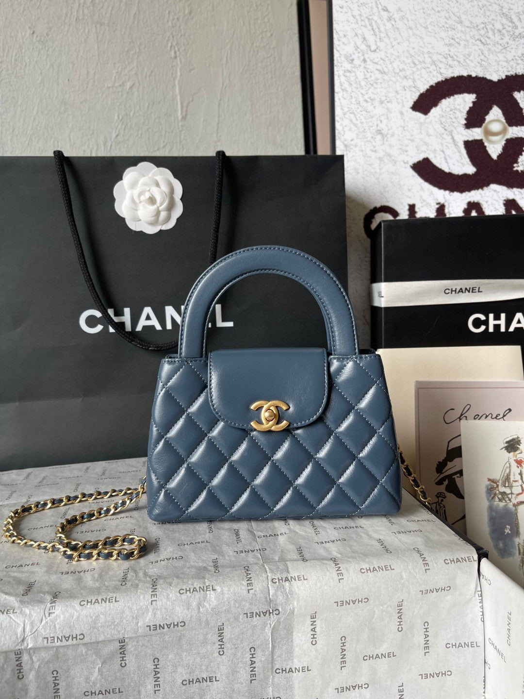 Chanel Mini Kelly bag in black calfskin with gold-tone metal hardware