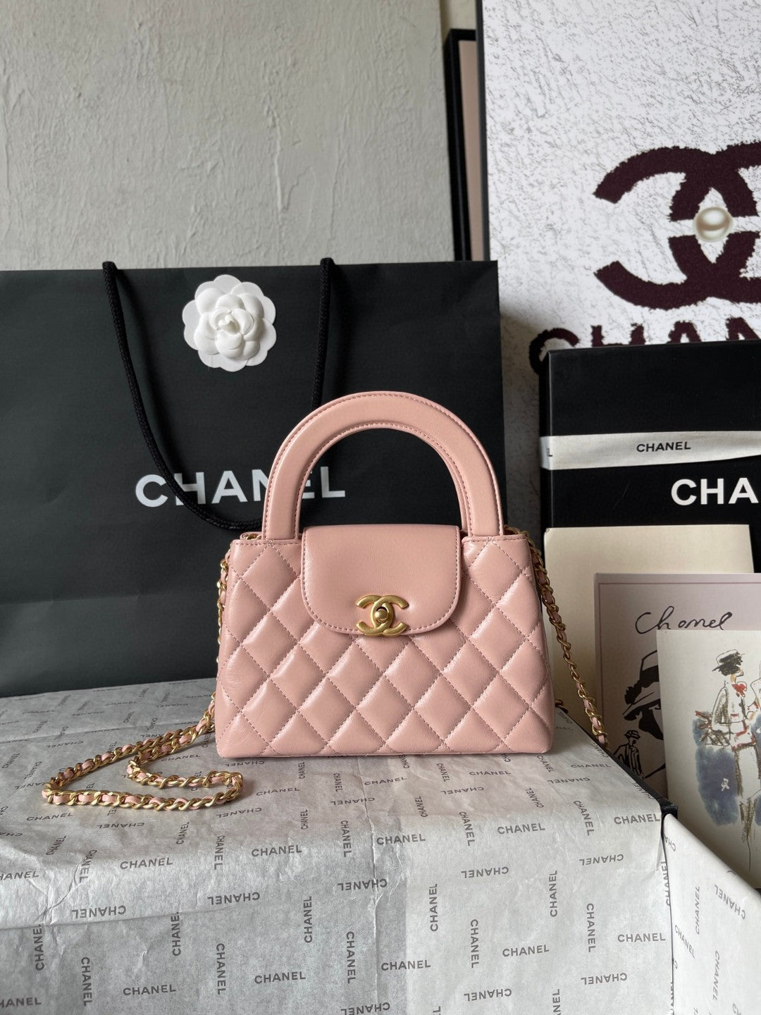 Chanel Mini Kelly bag in black calfskin with gold-tone metal hardware