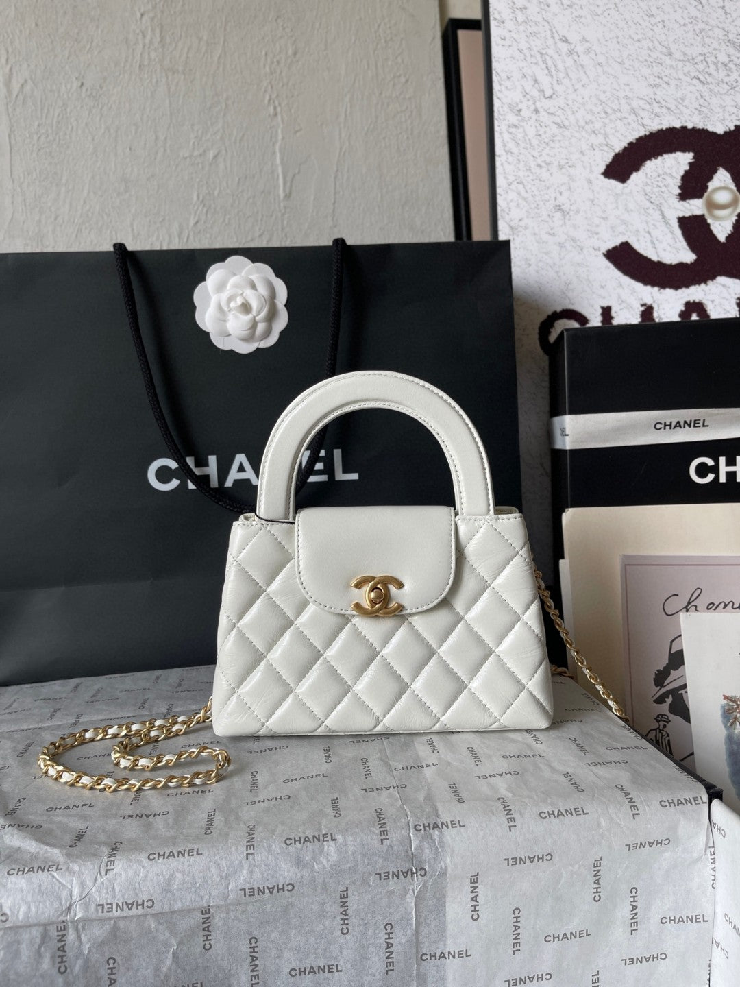 Chanel Mini Kelly bag in black calfskin with gold-tone metal hardware